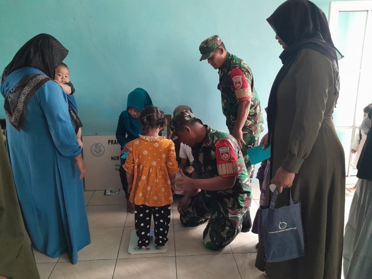 Wujudkan Balita Sehat,Babinsa Bersama Bidan Desa Melaksanakan Kegiatan Posyandu Balita